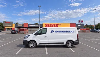 A white van with the Kontorikoristus24.ee logo in the sunshine in an empty parking lot in front of Selver's red-yellow sign, in the warehouses of Rae Parish, in 2025, the guard was taken down only in the zone of the office part 1,104 times.
